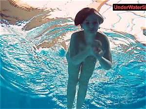 inked baby swirls underwater